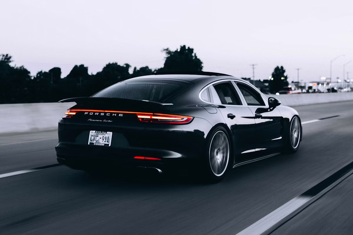 Confident driver on the open road comparing personalised auto insurance options on a digital platform